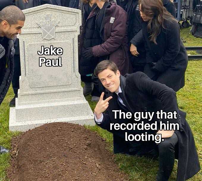 man in a suit kneeling next to a grave with a sign that says, the guy that recorded him looking