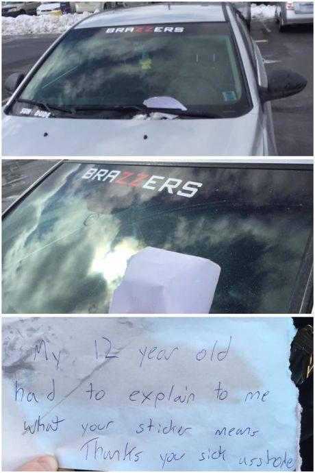 a close up of a car with a note attached to it