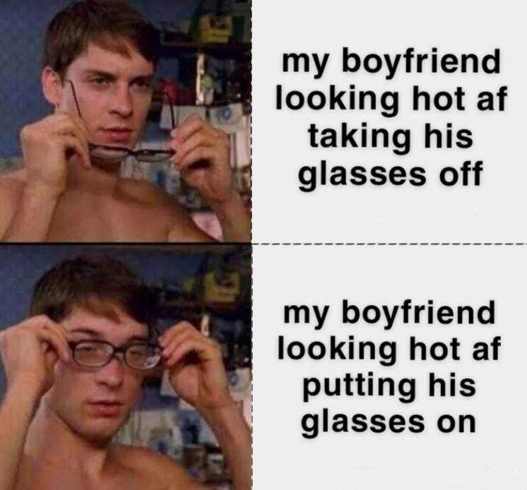 a close up of a person holding a pair of glasses