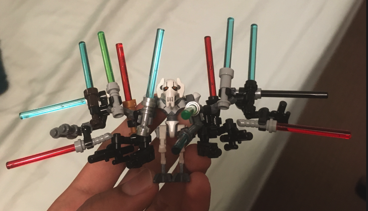 there are many lightsabers that are in a hand