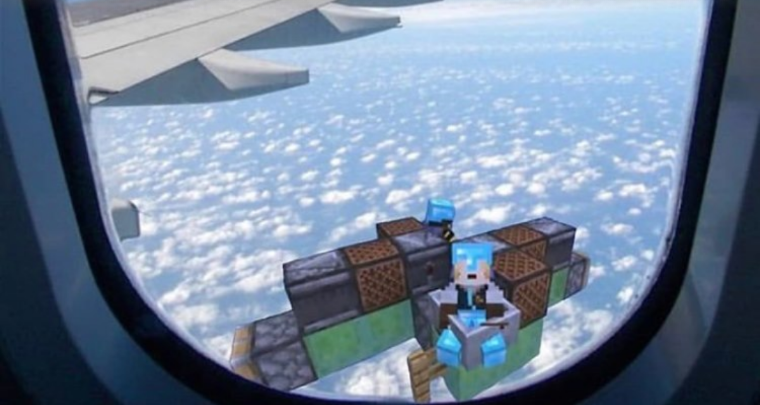 a close up of a window view of a plane flying over clouds