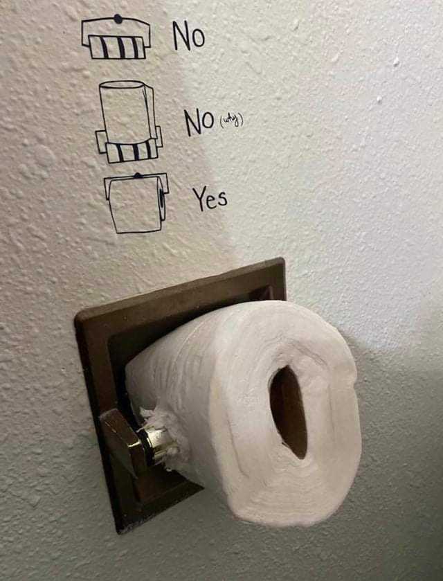 there is a toilet paper roll with a drawing on it