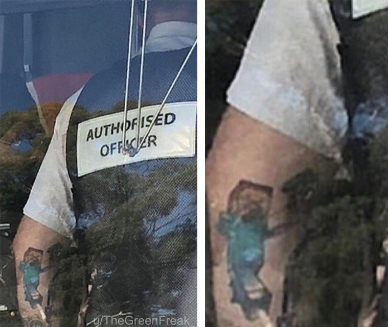 arafied officer with a tattoo on his arm and a sticker on his arm