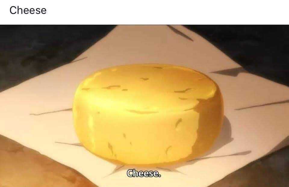 there is a cheese on a piece of paper on a table