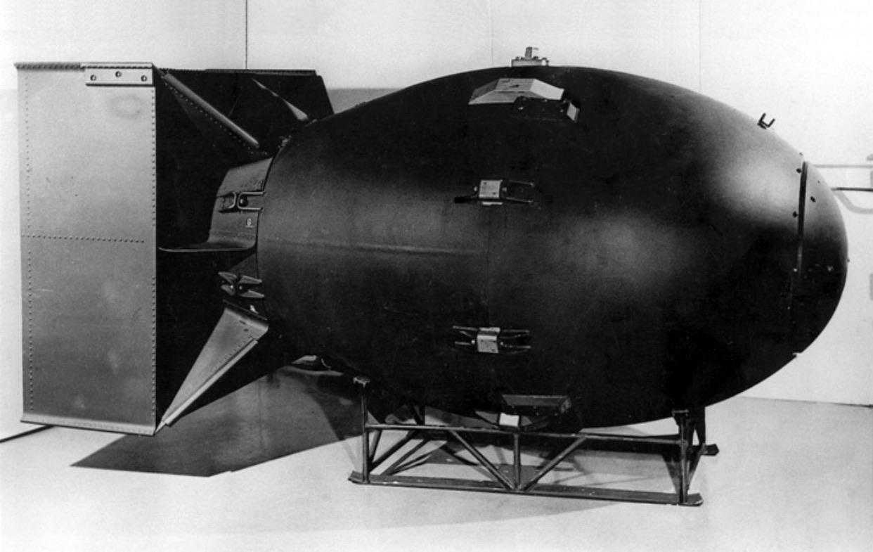 a black and white photo of a large metal object in a room