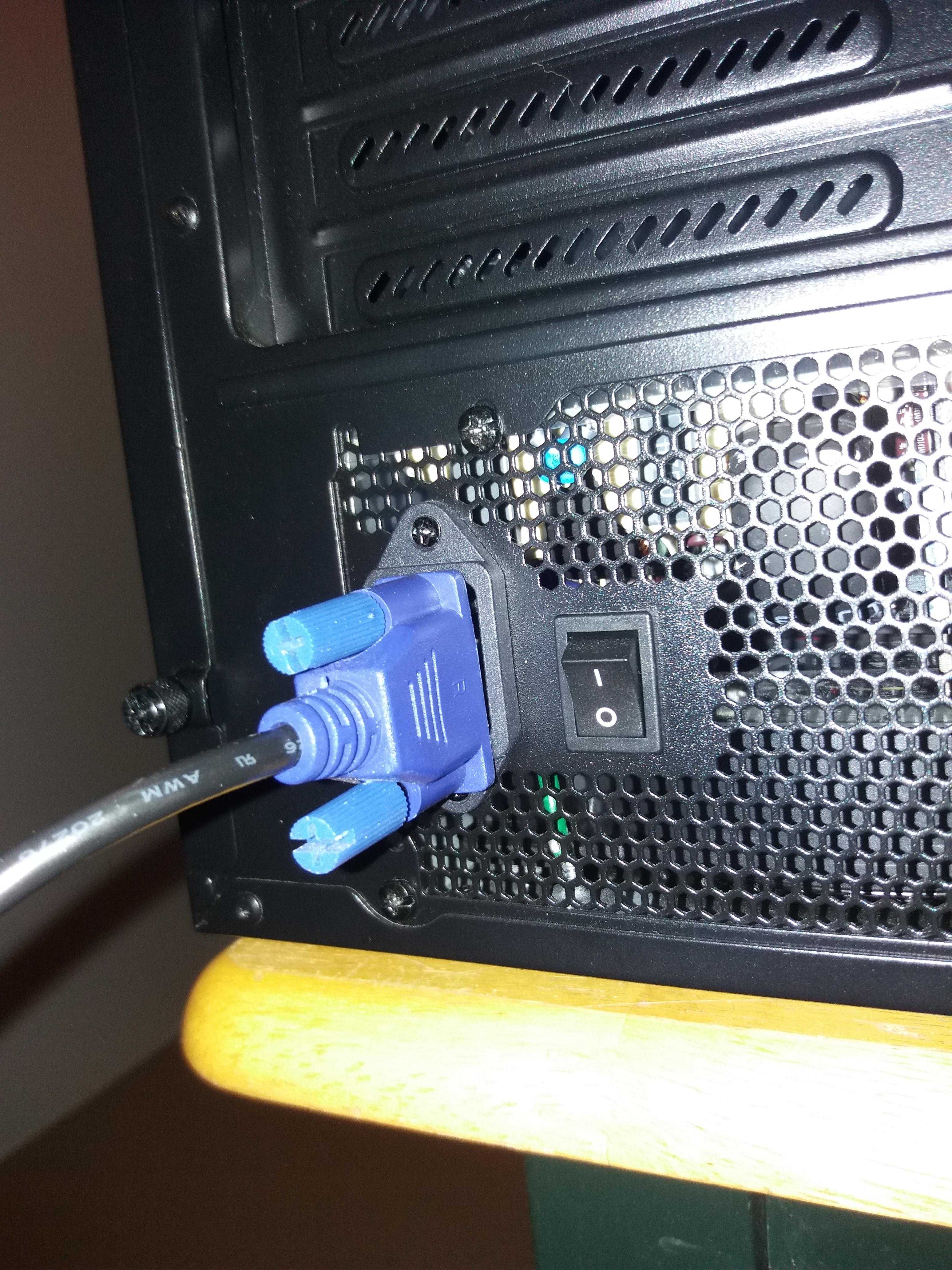 a close up of a computer with a blue cable plugged into it