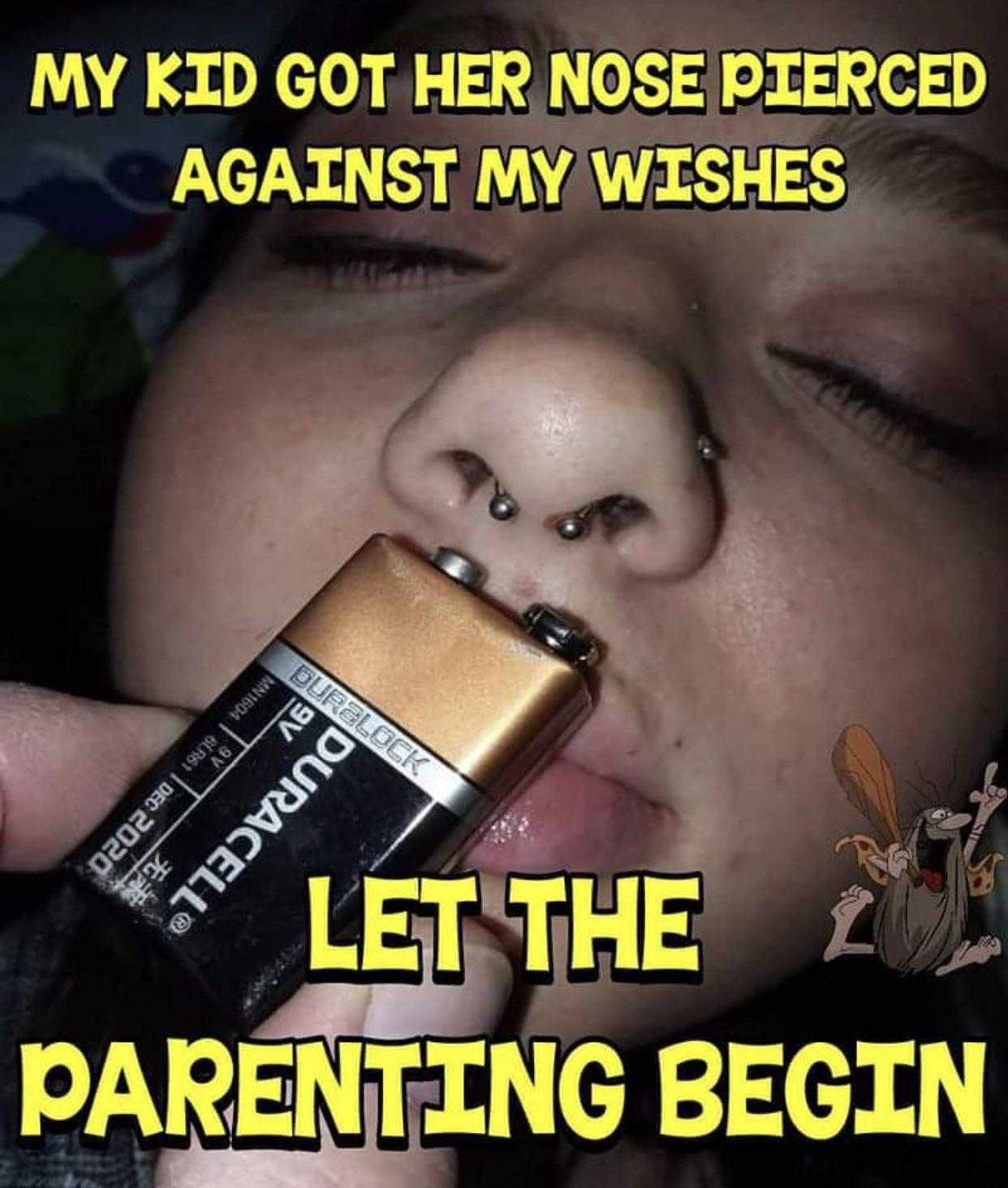 there is a child that is holding a battery in his mouth