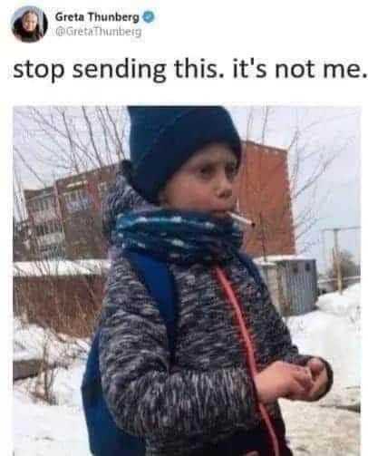 kid with a cigarette in his mouth standing in the snow