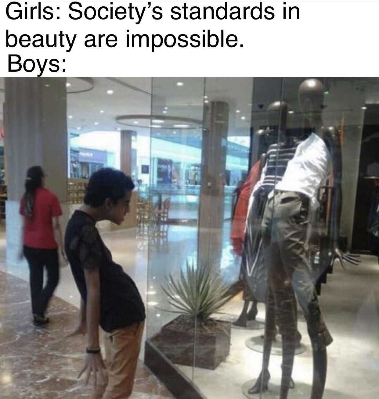 image of a boy looking at a mannequin in a store