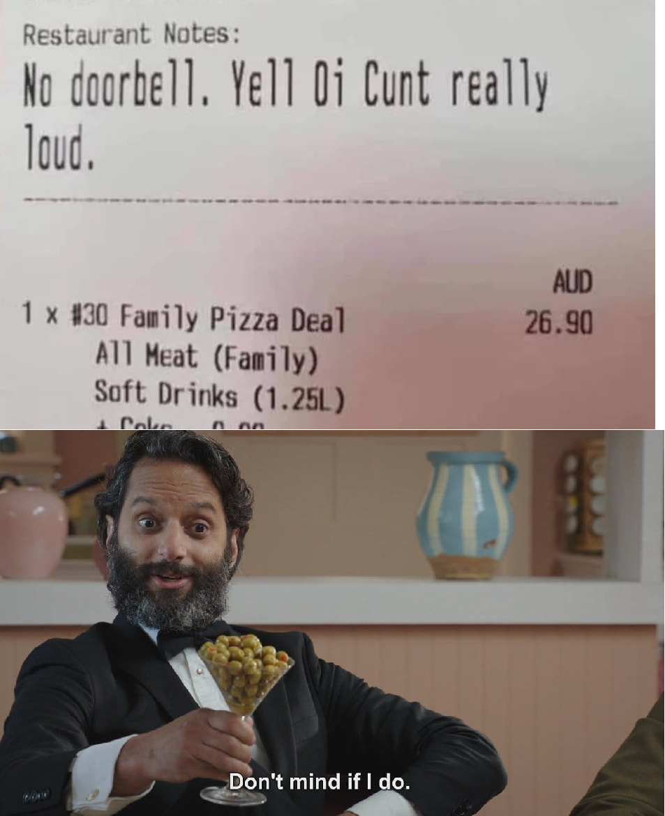 there is a man in a suit holding a pizza and a sign