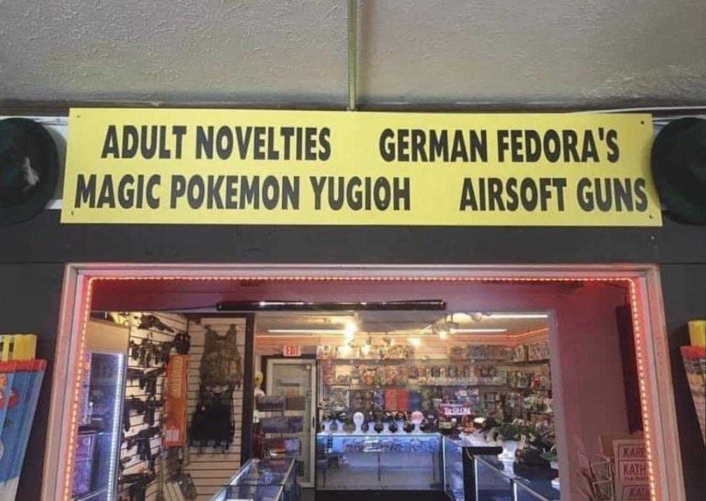 there is a sign that says adult novelies german fedora ' s magic pokemon yuugh airsoft guns