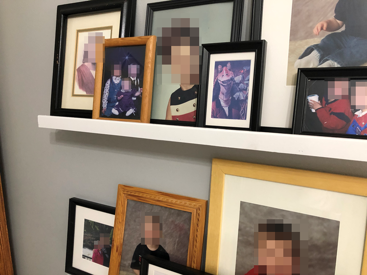 there are many pictures of people on the wall above a shelf