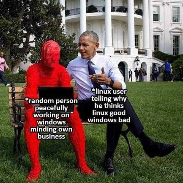 obama sitting in front of a red spider man statue