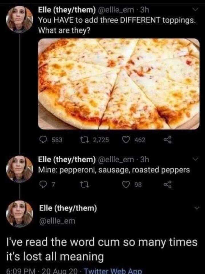 a close up of a pizza on a table with people on it