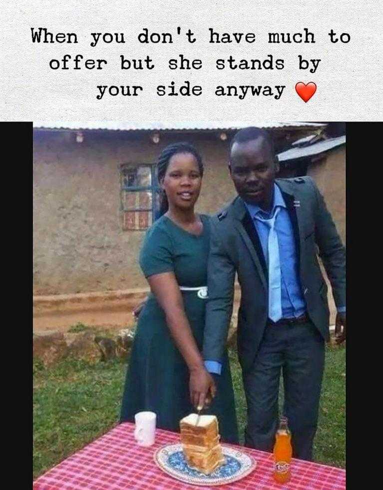 there is a man and woman standing next to a cake