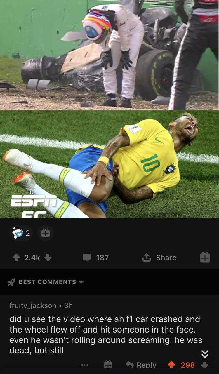 a close up of a person laying on a field with a soccer ball