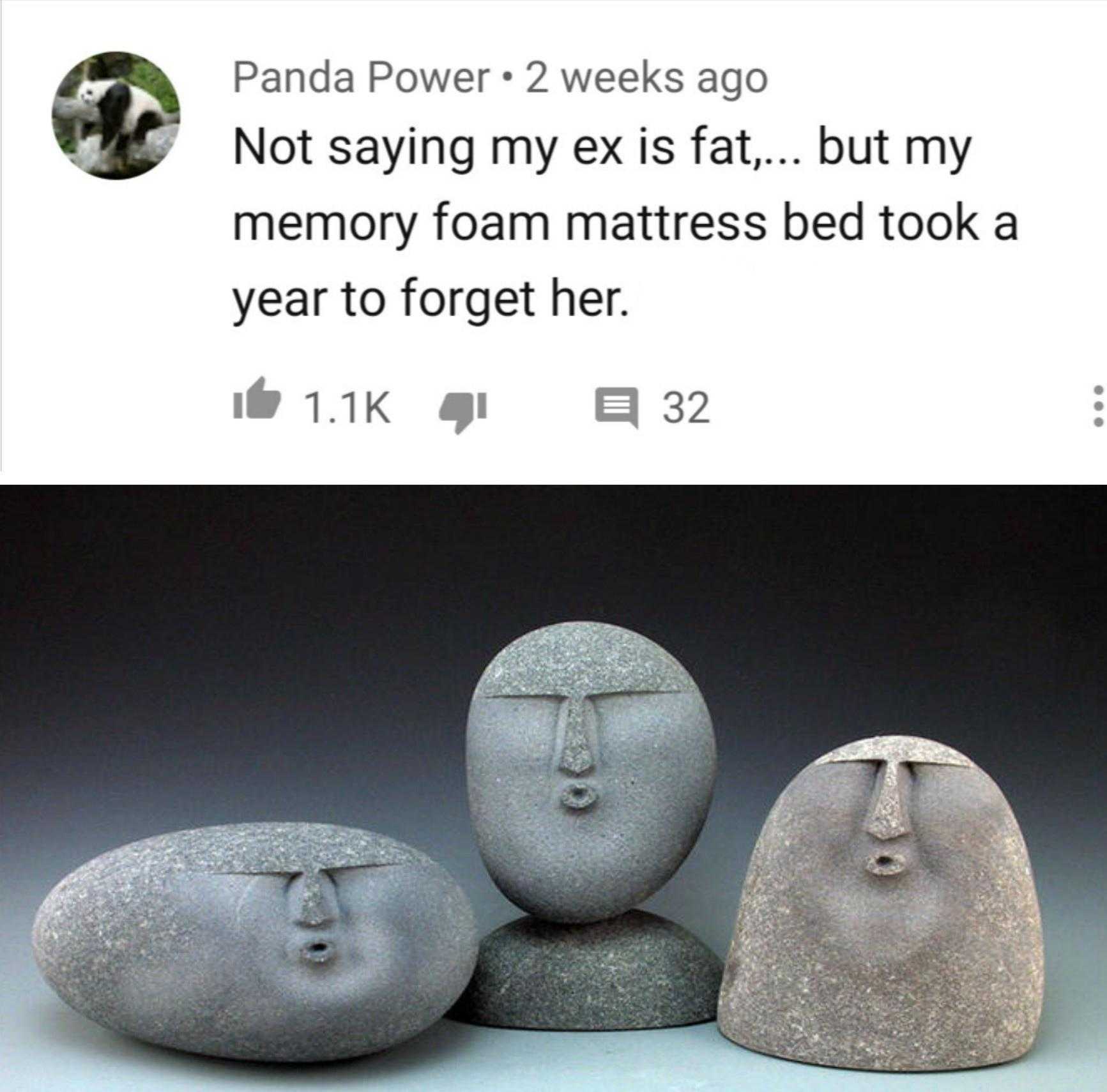 stone sculptures of faces and faces on a table