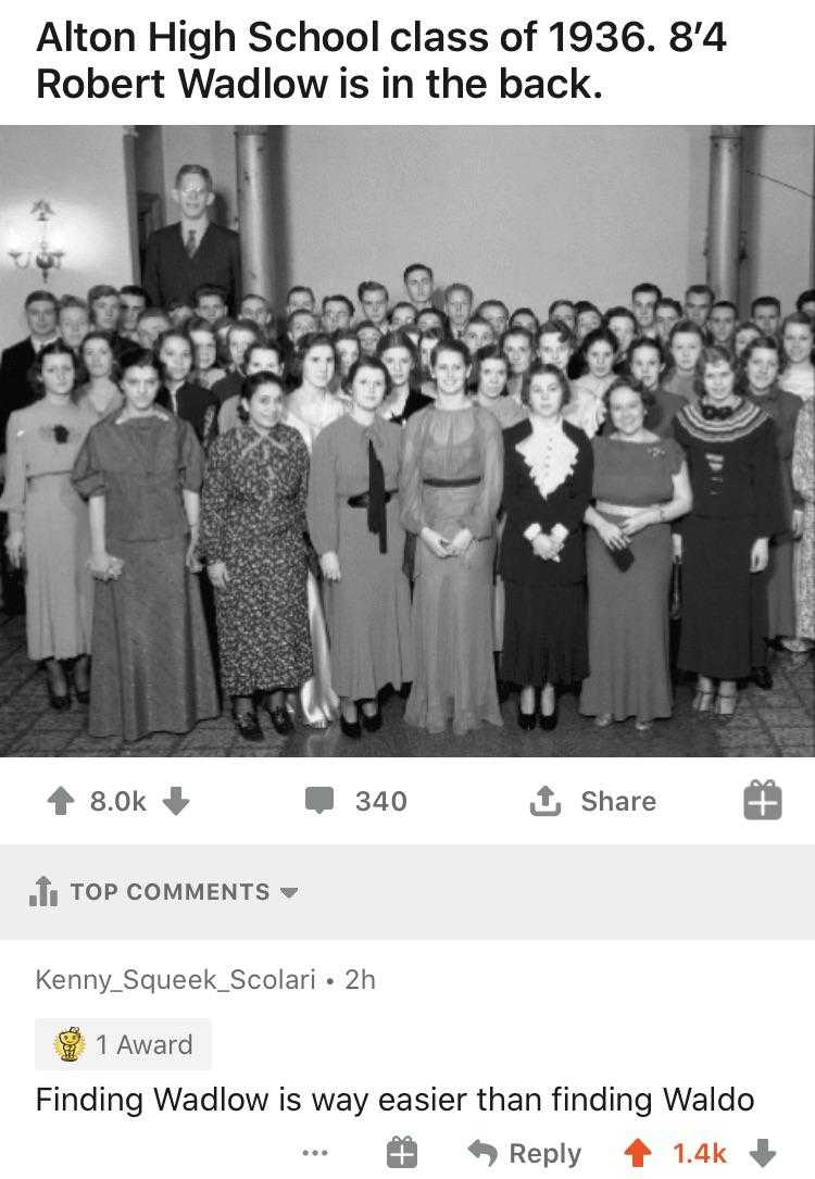 a black and white photo of a group of people standing together