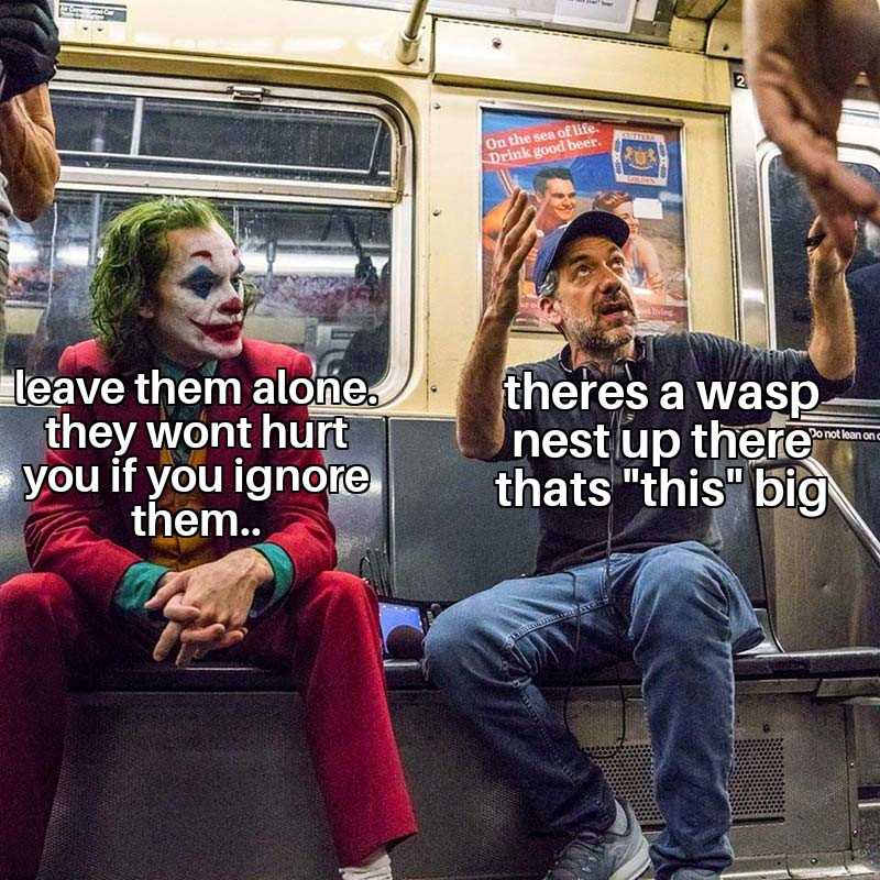 there is a man sitting on a subway with a clown face