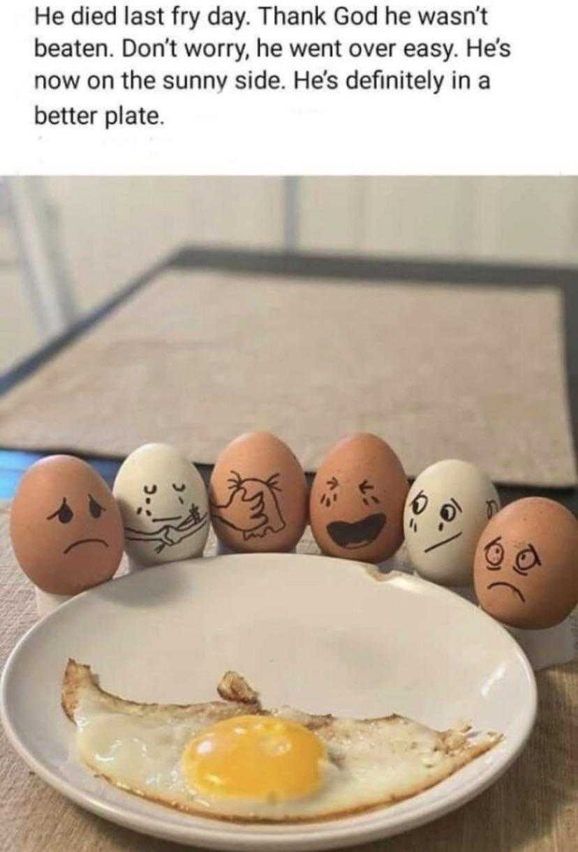 eggs with faces drawn on them are arranged in a line on a plate