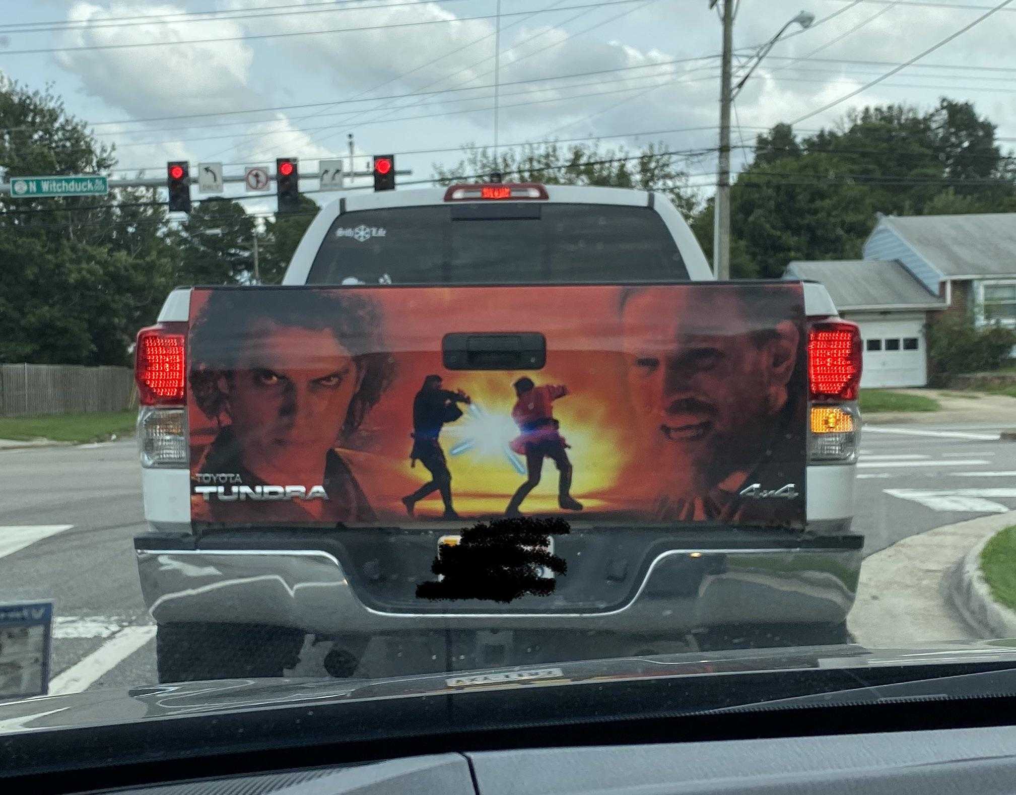 back of a truck with a back of a movie poster on it