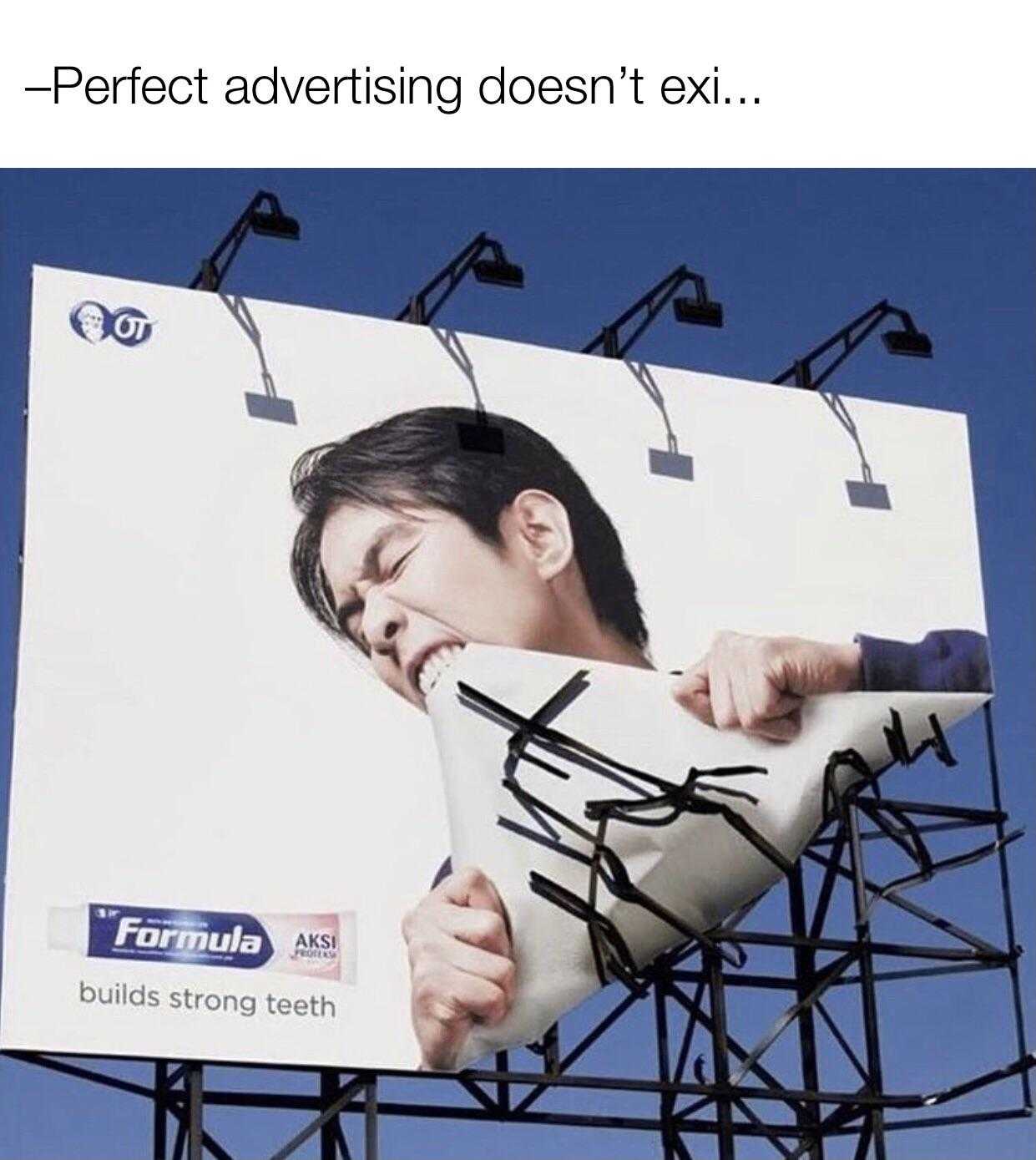 billboard with a man holding a toothbrush in his mouth