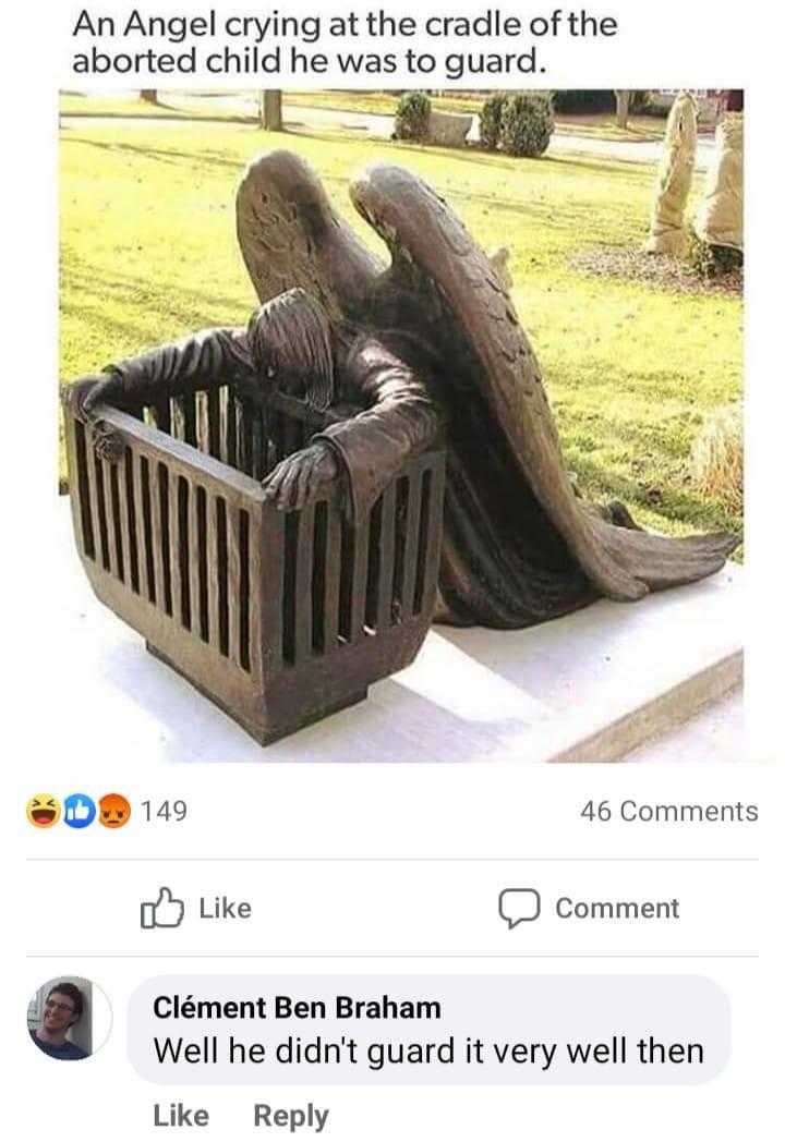 a close up of a statue of an angel sitting on a bench