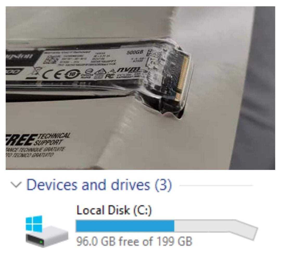 a close up of a computer drive with a small disk attached