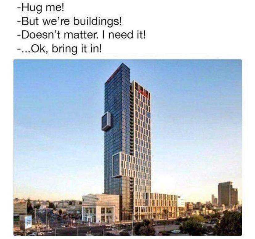 image of a tall building with a sign that says hug me building doesn ' t matter, i need it ok, bring it in