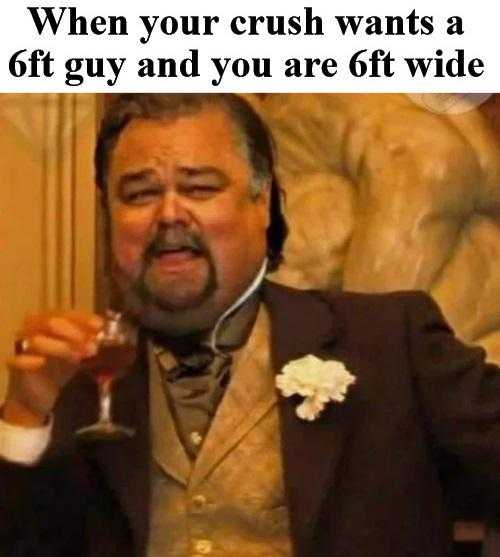 man in a suit holding a glass of wine