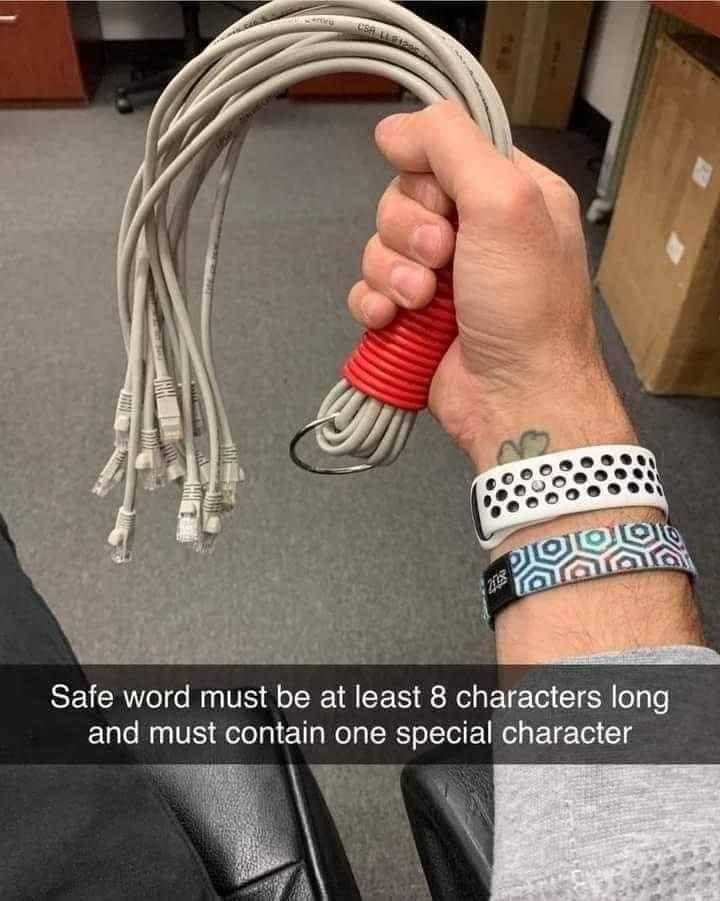 someone holding a red and white cord with a wrist strap