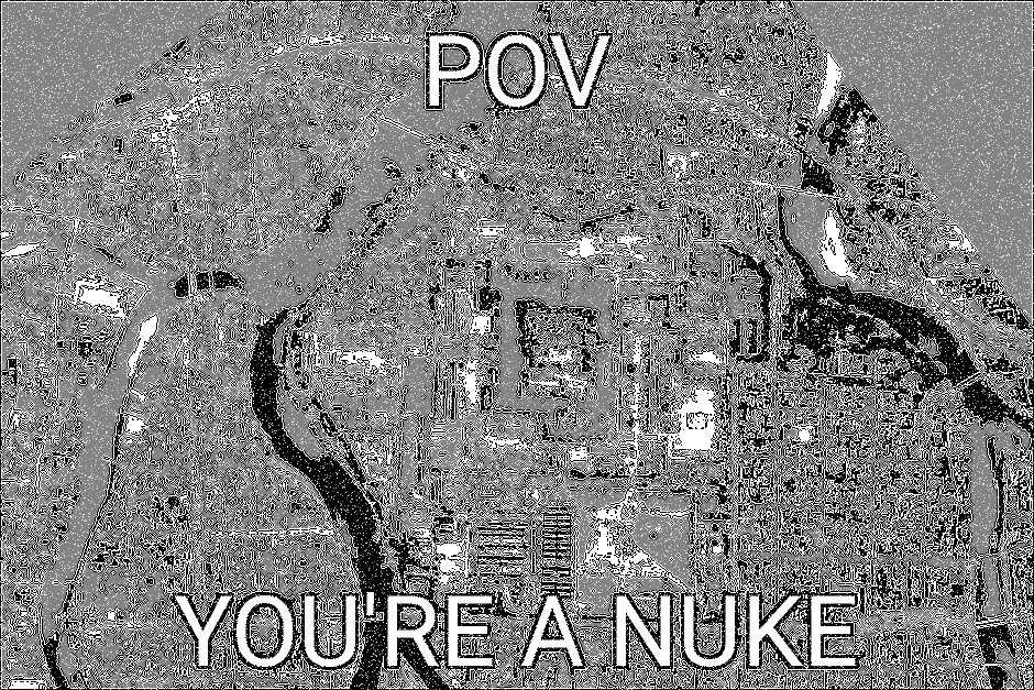 a black and white photo of a rock with a message that says pov you ' re a nuke