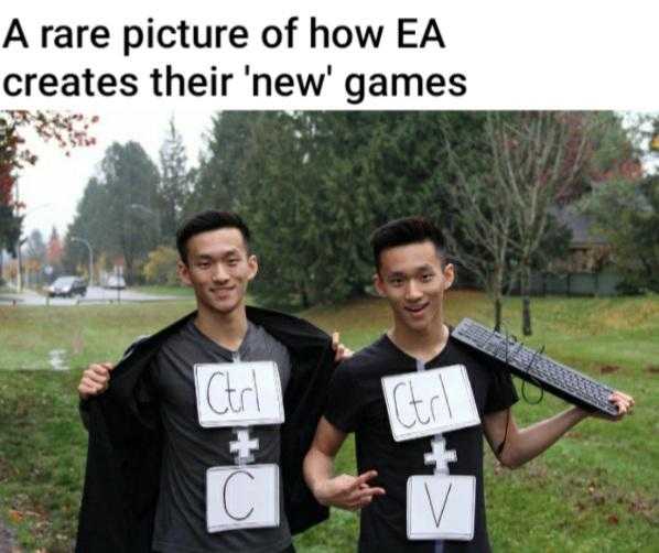 two men holding up signs that say, i ' m a picture of how ea creates their new games