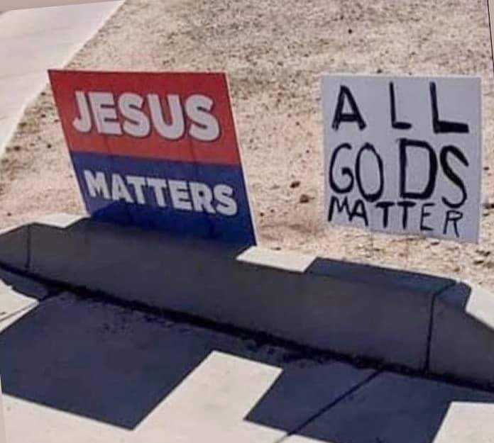 signs on the side of the road that say all gods matter