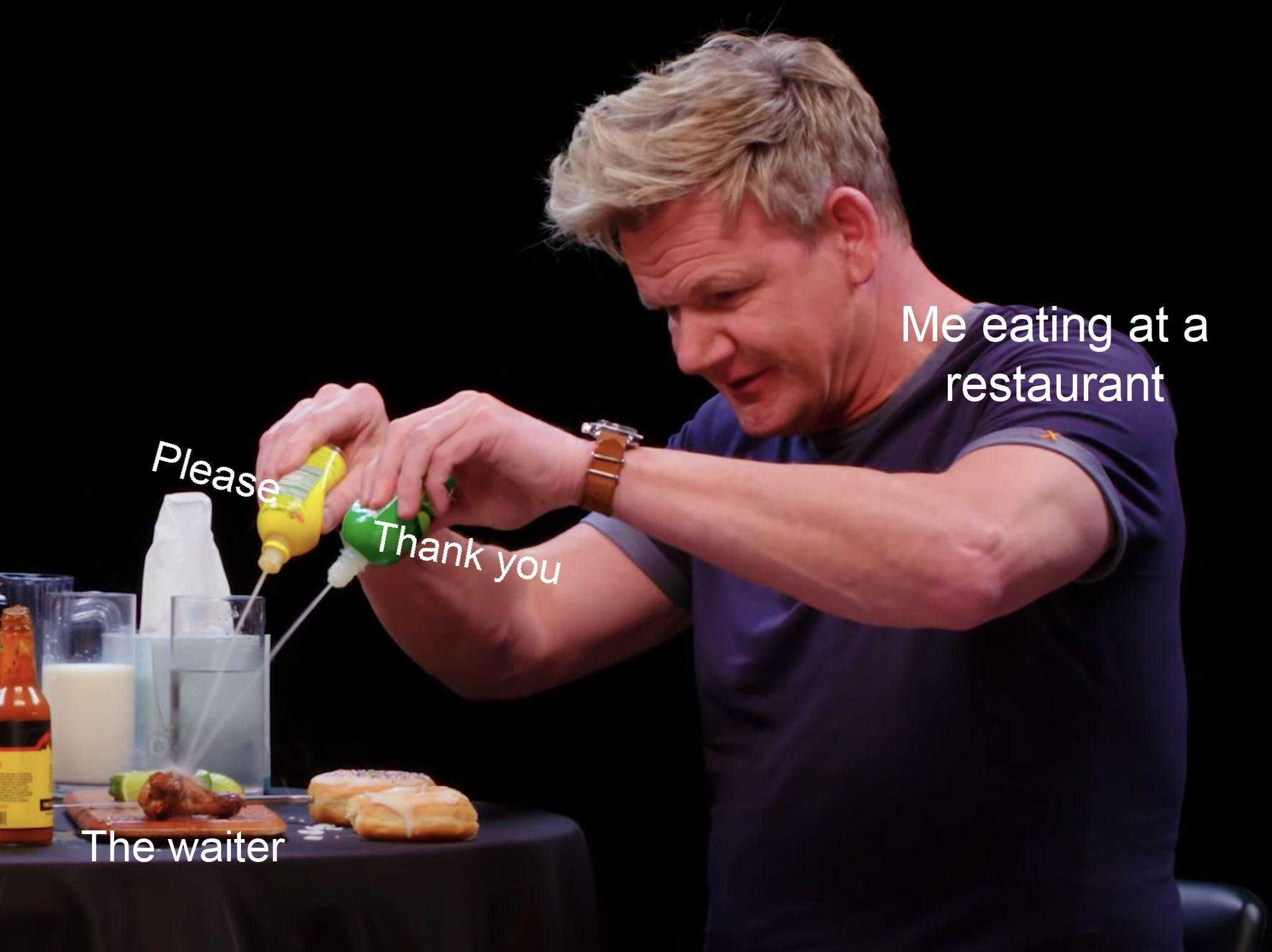 man pouring something into a glass with a bottle