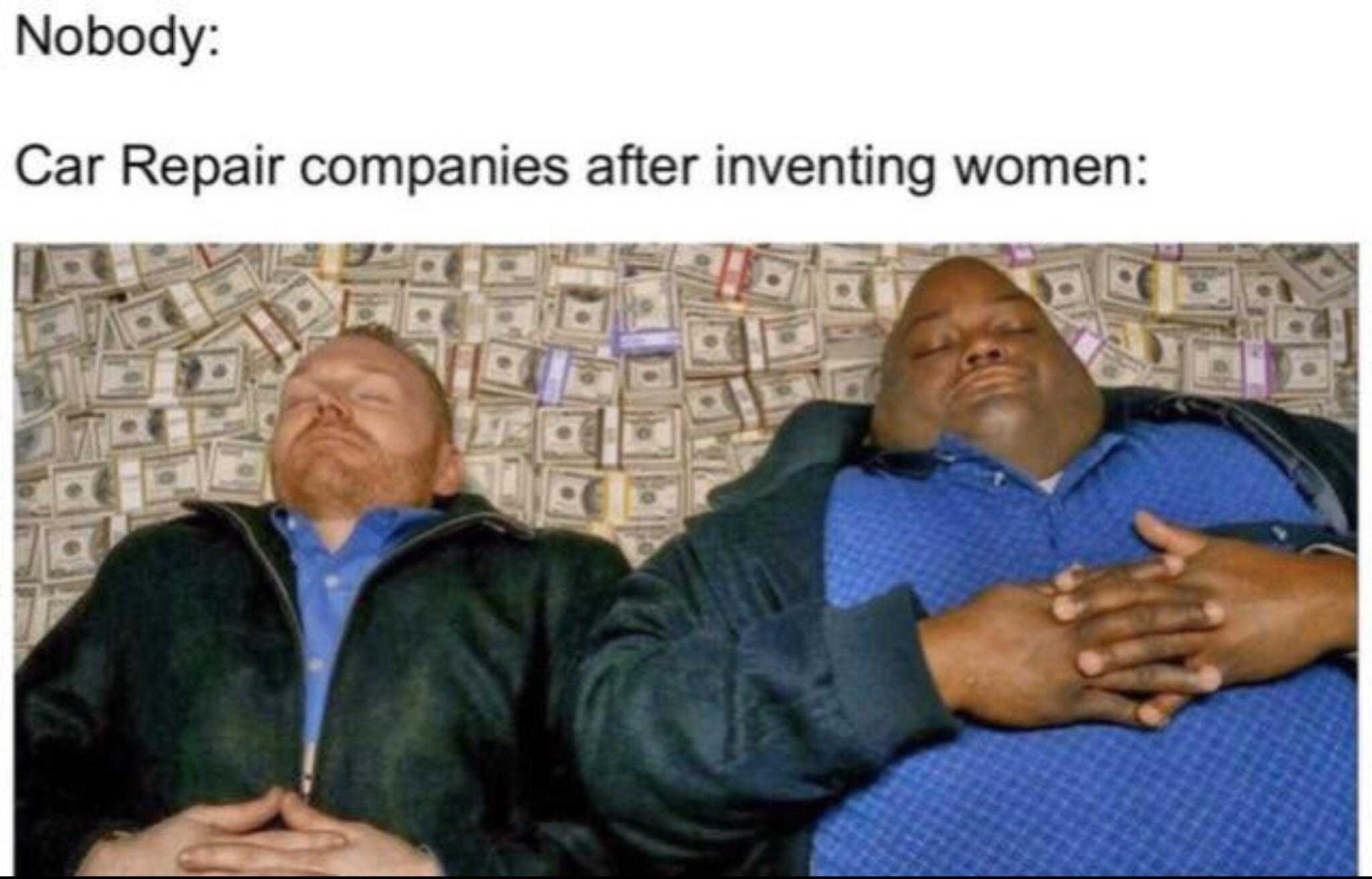 two men laying on a bed with money all over them