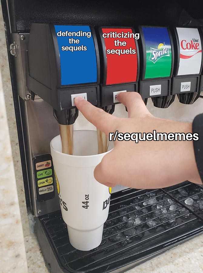 someone is holding a cup of coffee in front of a vending machine