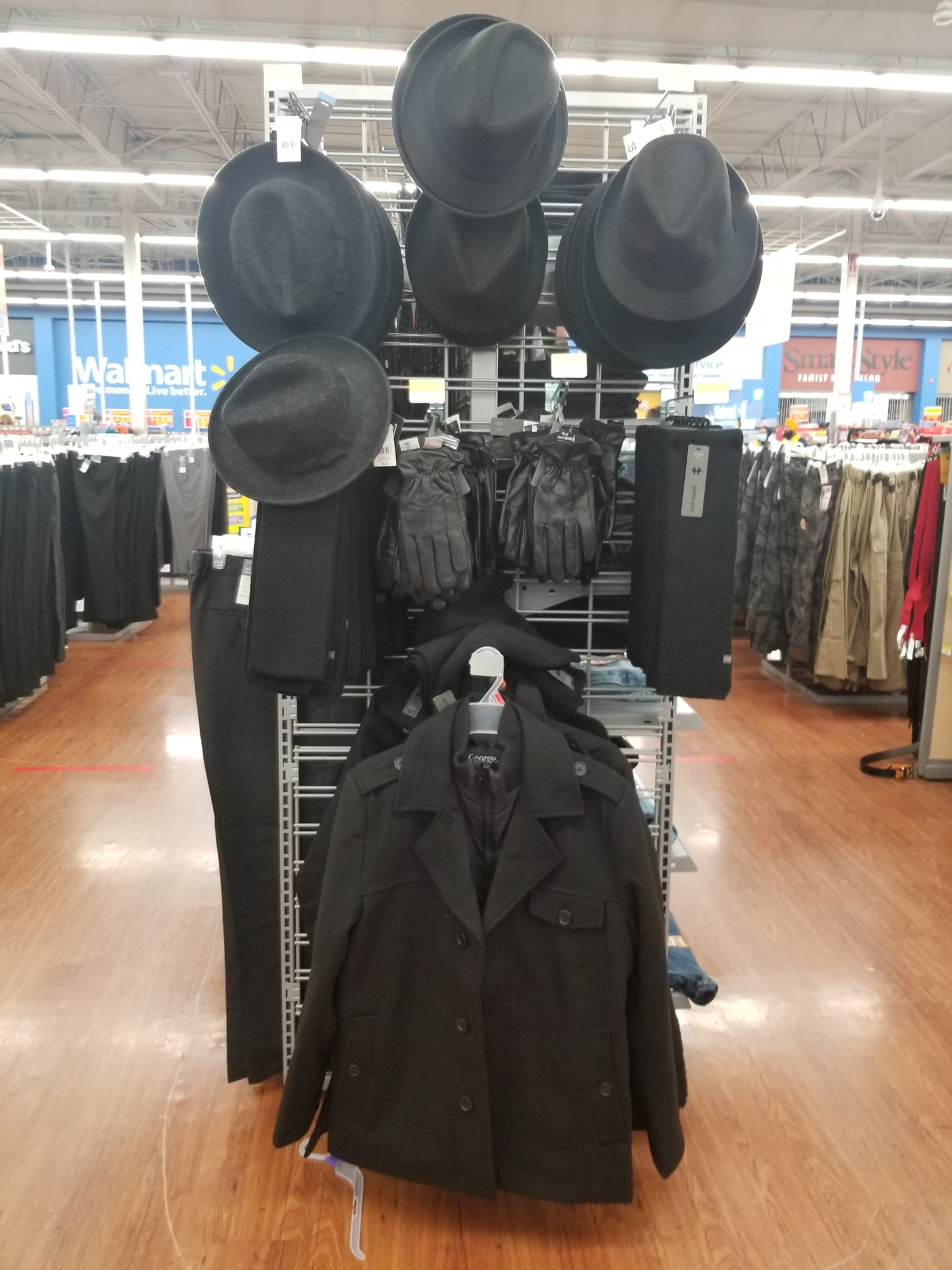 there are many hats and jackets on display in a store