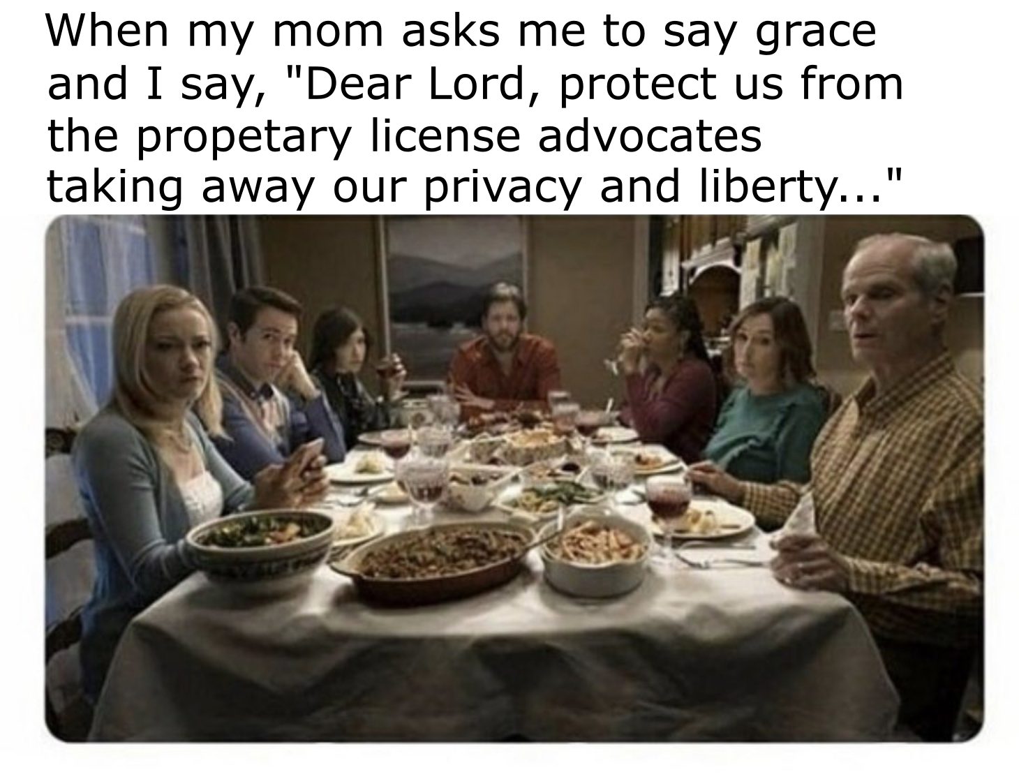 image of a group of people sitting around a table with food