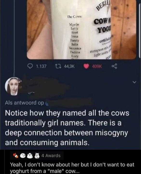 someone is holding a bottle of milk with a cow on it