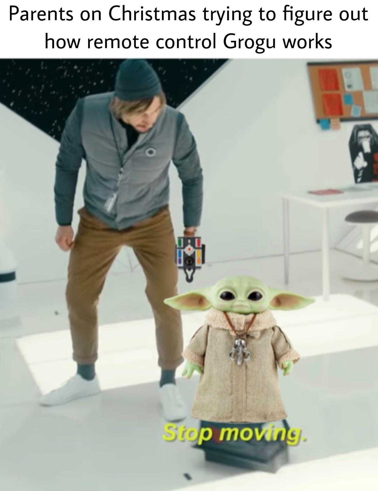 a close up of a person standing next to a baby yoda