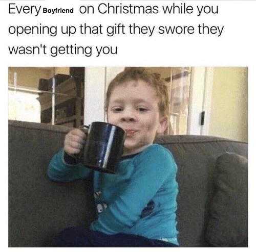 kid sitting on a couch holding a coffee mug