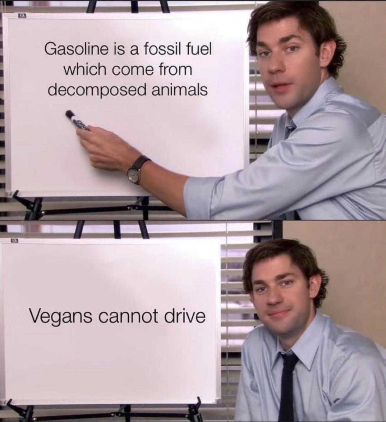 man in a blue shirt and tie holding a sign that says gasoline is a fossil fuel which come from decomposed animals vegas cannot ' t drive