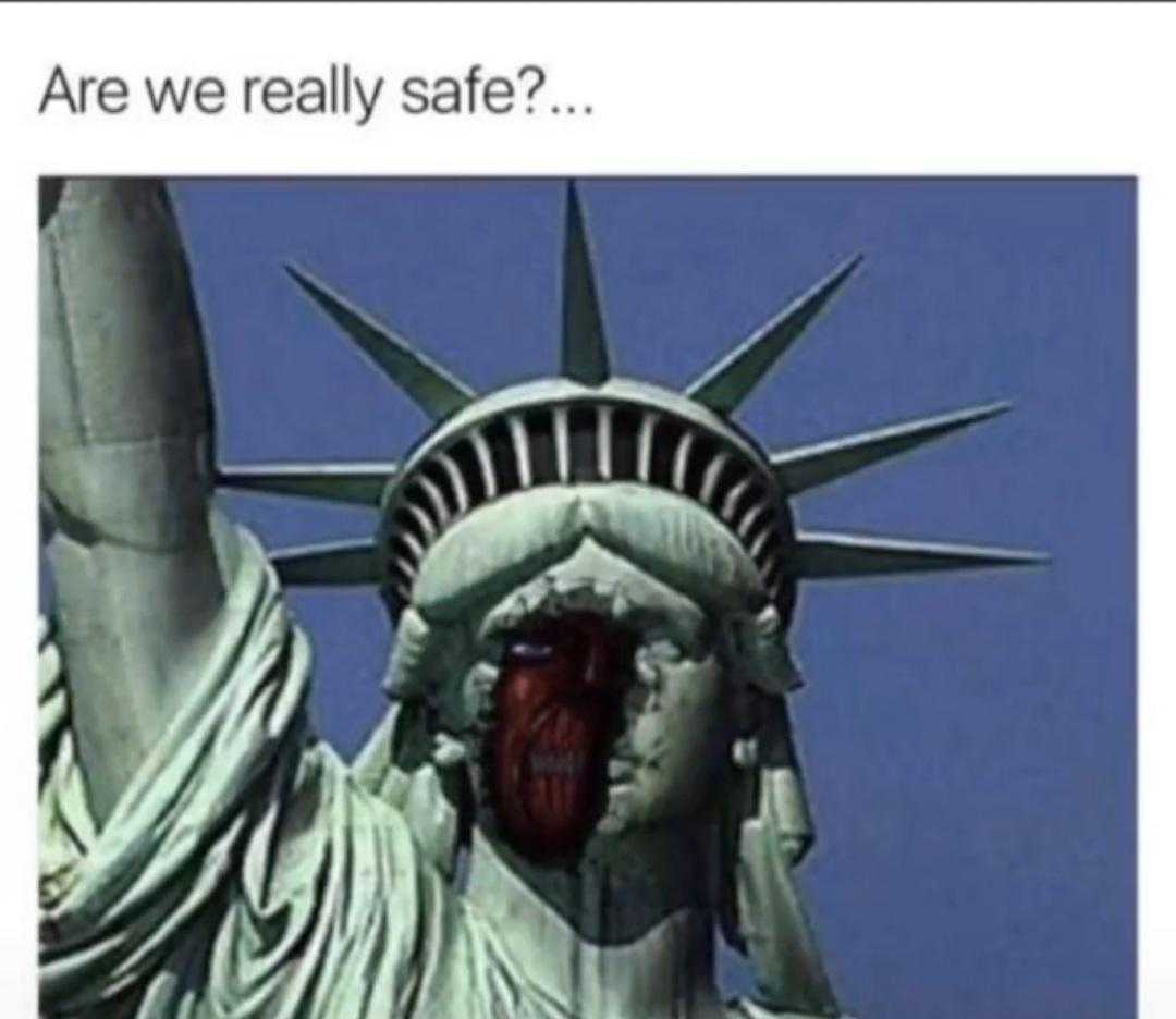 a close up of a statue of liberty with a bloody face