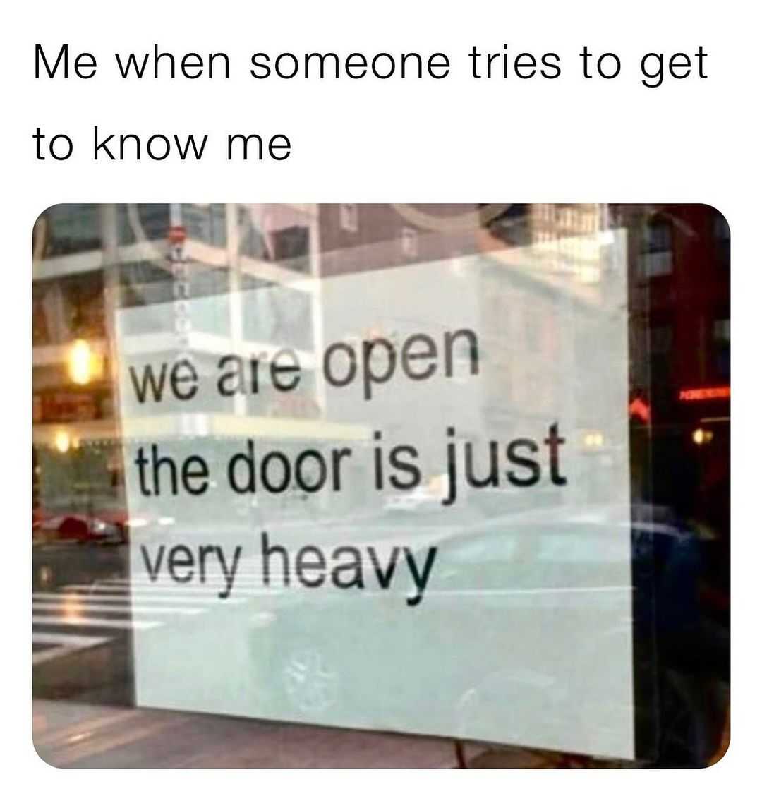 sign in a window saying, ' me when someone tries to get to know me '