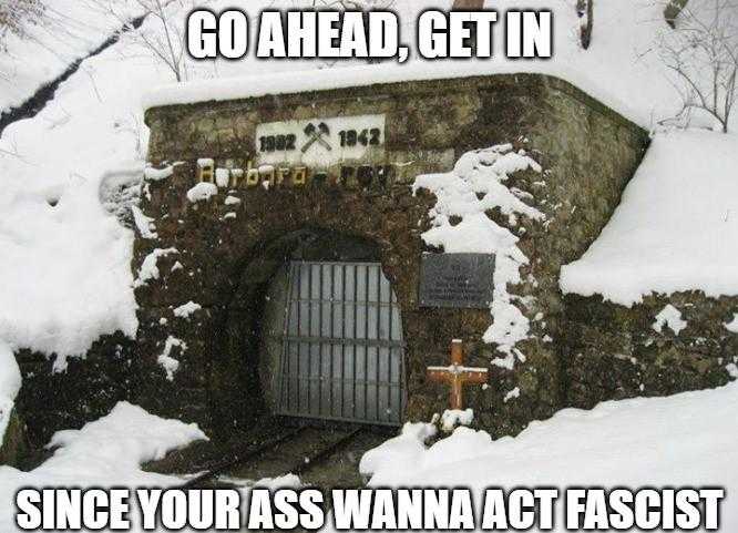 there is a stone tunnel with a sign on it that says go ahead get in since you pass wanna act