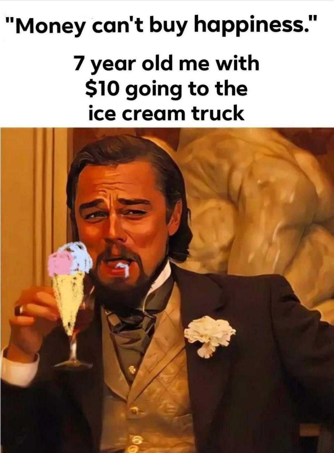 man in a tuxedo holding a glass of ice cream