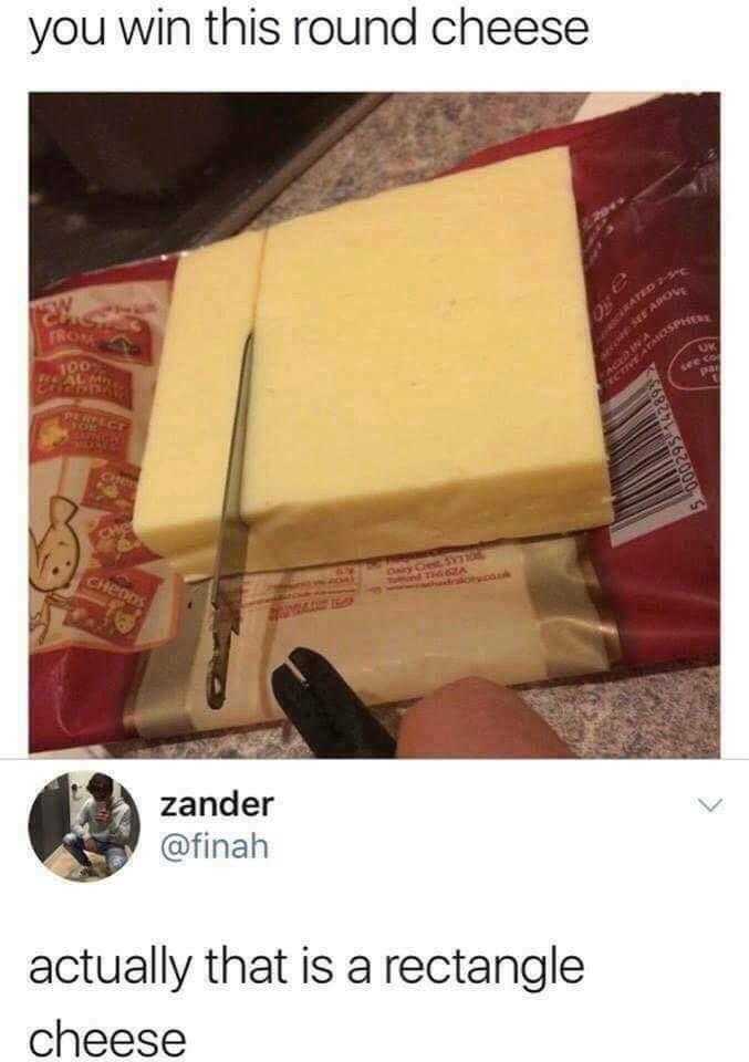 someone is cutting a piece of cheese with a knife