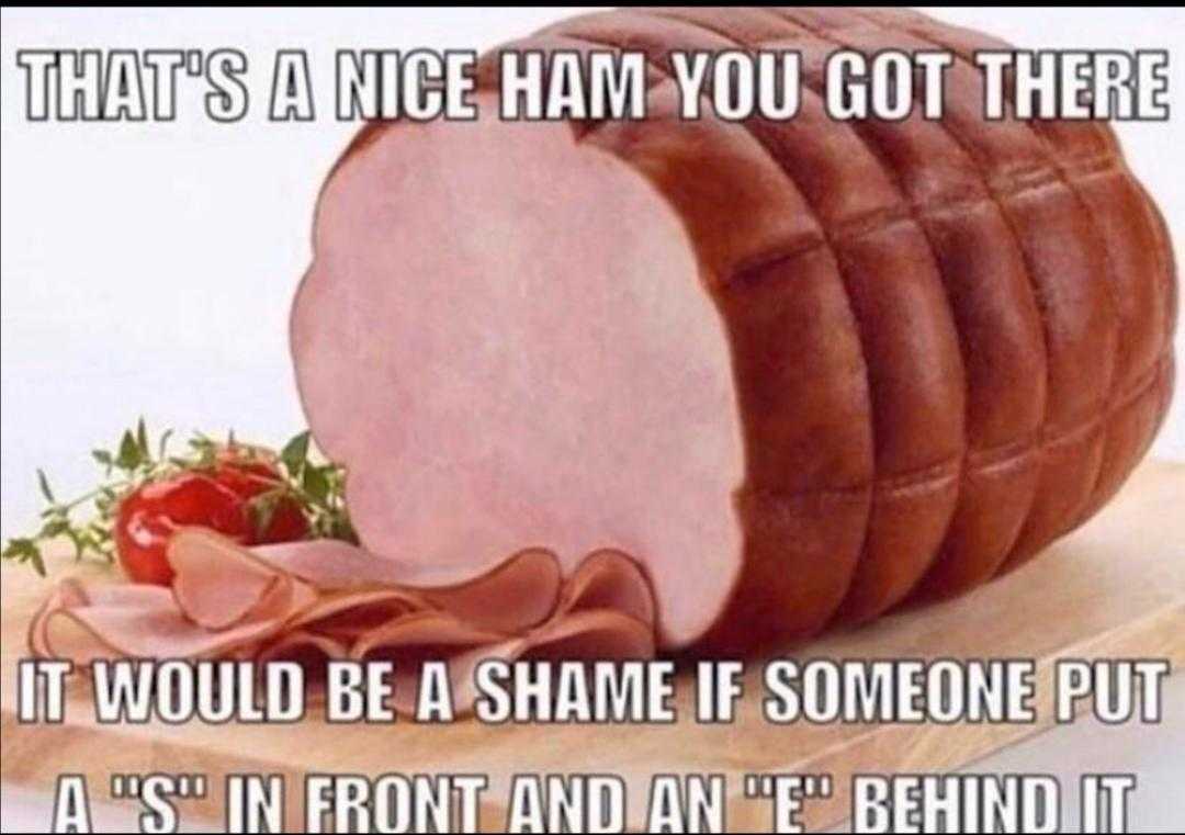 there is a ham that is cut into pieces on a cutting board