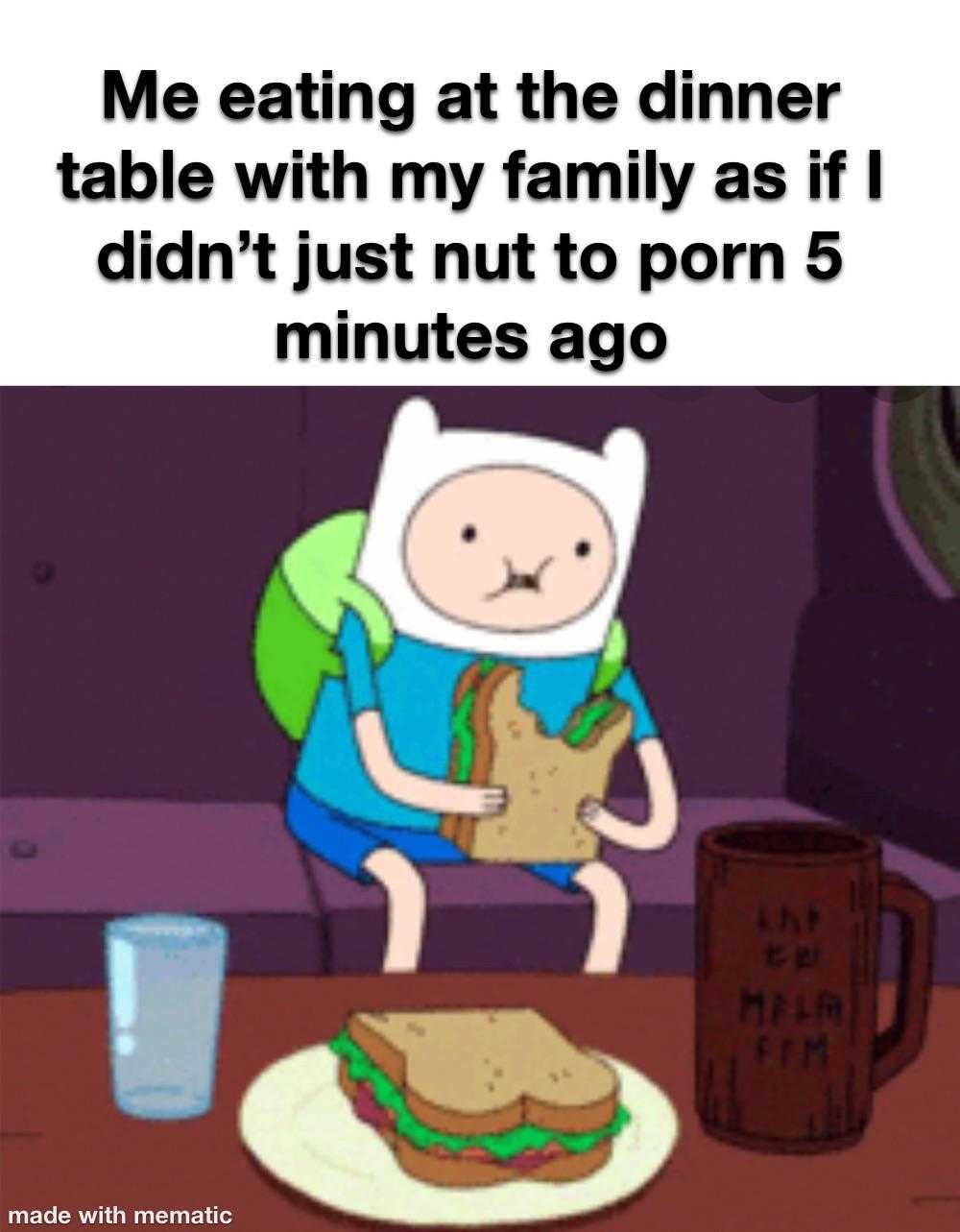 a cartoon character sitting at a table with a sandwich and a glass of water